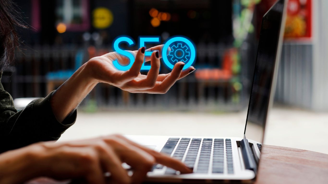 SEO on hand laptop.