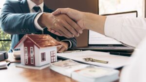 Real estate investor shaking hands.